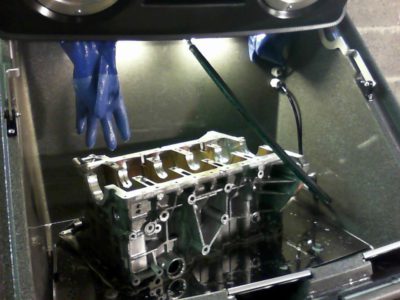 Cleaning BMW header in Torrent 500 parts cleaning machine